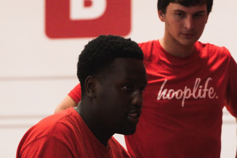 A HoopLife coach working closely with a single player in Regina