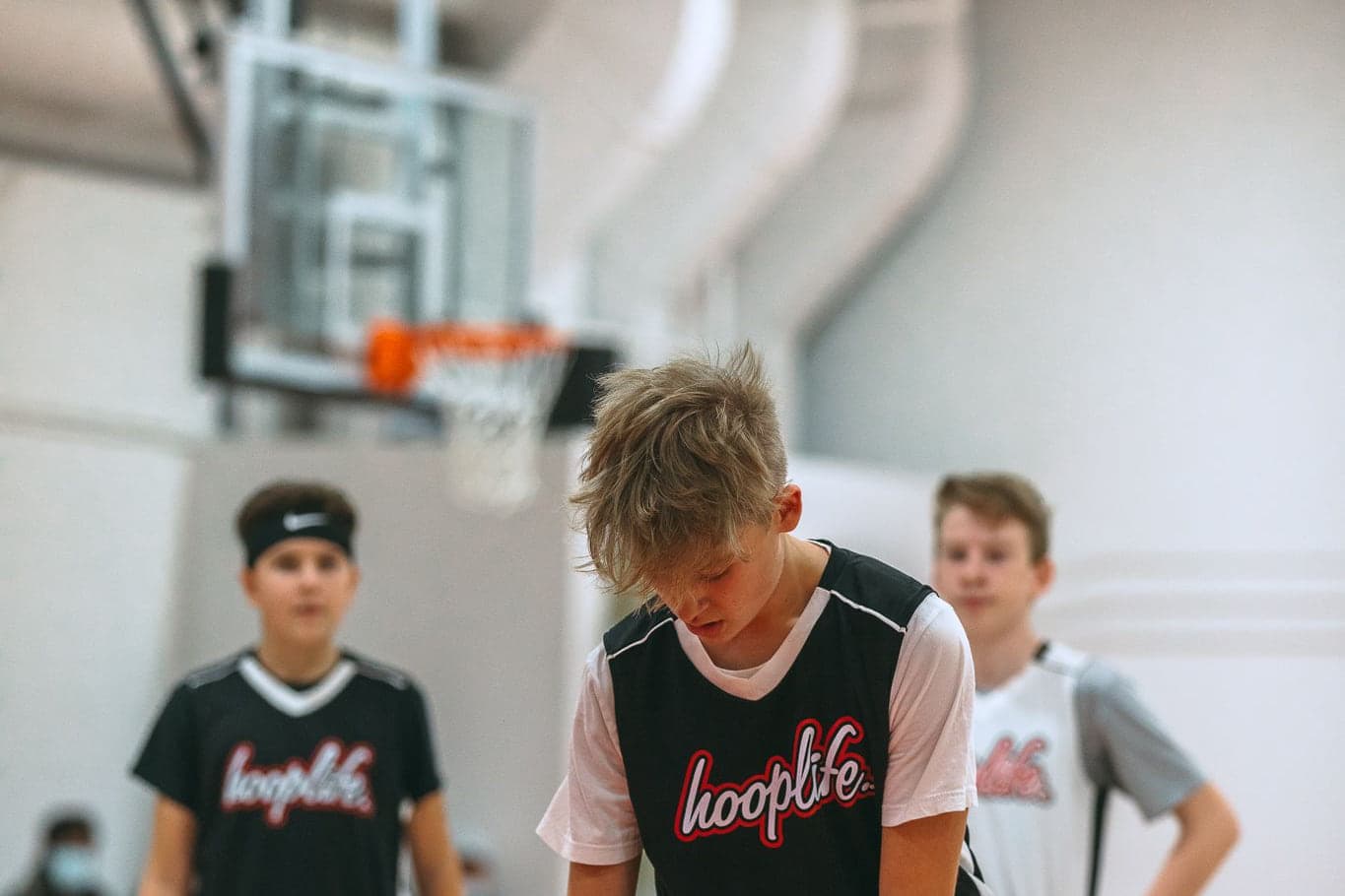 HoopLife League players waiting on court before a game in Regina
