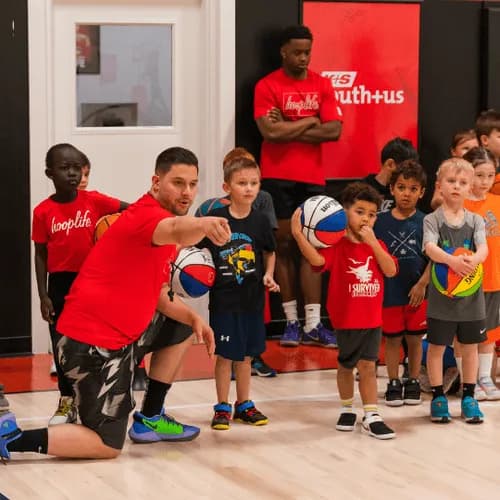 Coach Andrew explaining a drill to a group of Young Stars