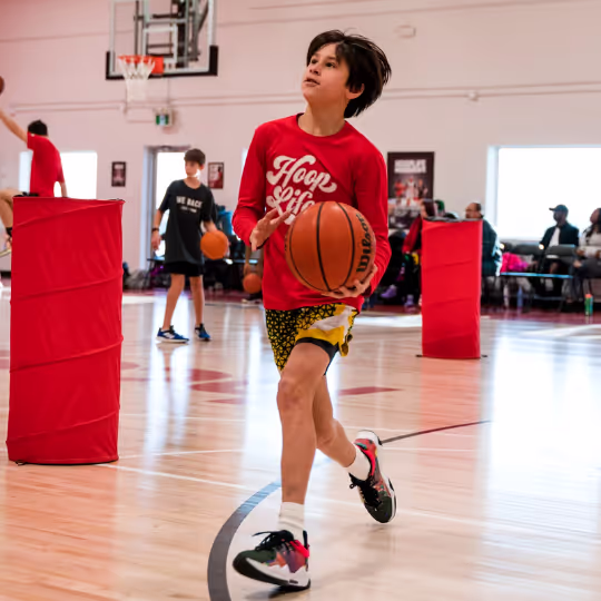 Athlete running with ball