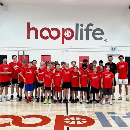 A full group of HoopLife players in red at the Regina facility