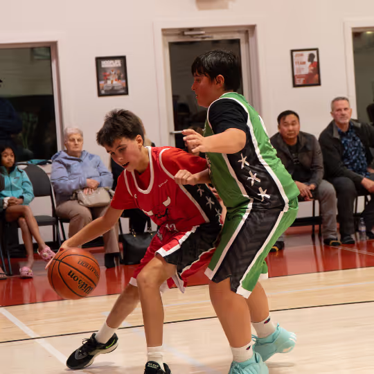 Two HoopLife League players going at it on defence
