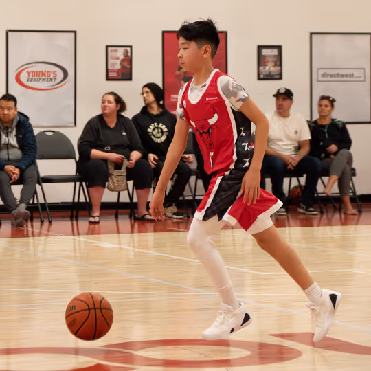 A HoopLife League player bringing the ball up our court in Regina