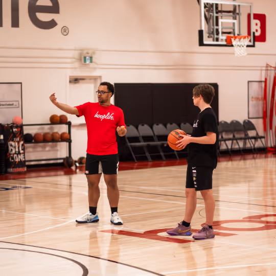 Coach teaching kid something