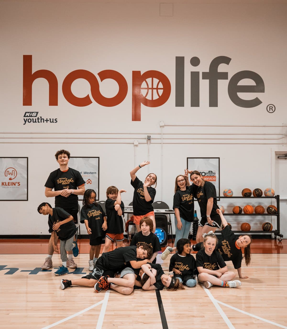A full group of HoopLife players under the HoopLife wordmark