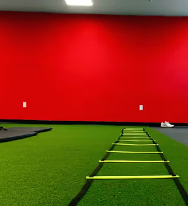 The turf training room at the HoopLife Centre with an agility ladder laid out