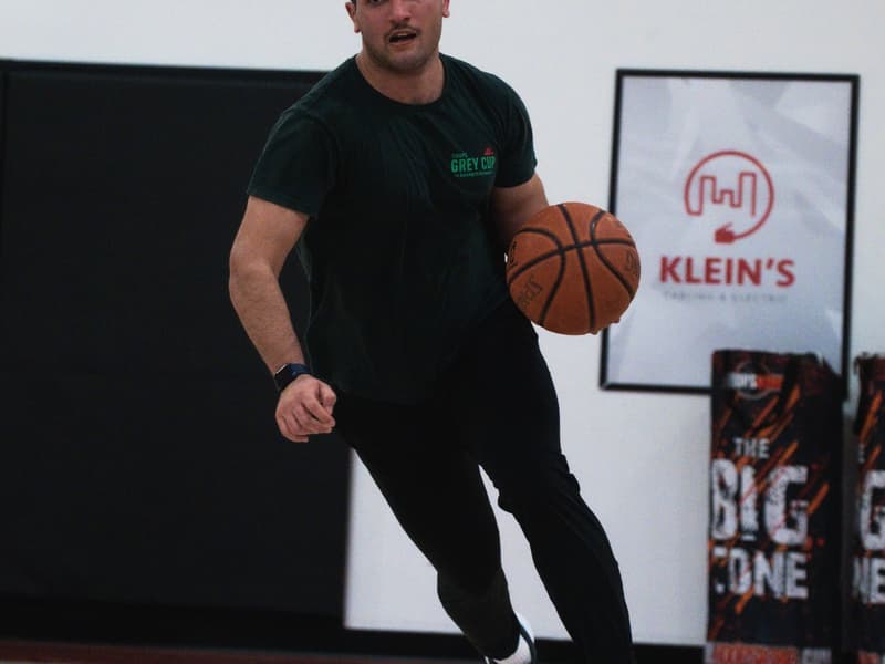 An adult league player attacking the rim