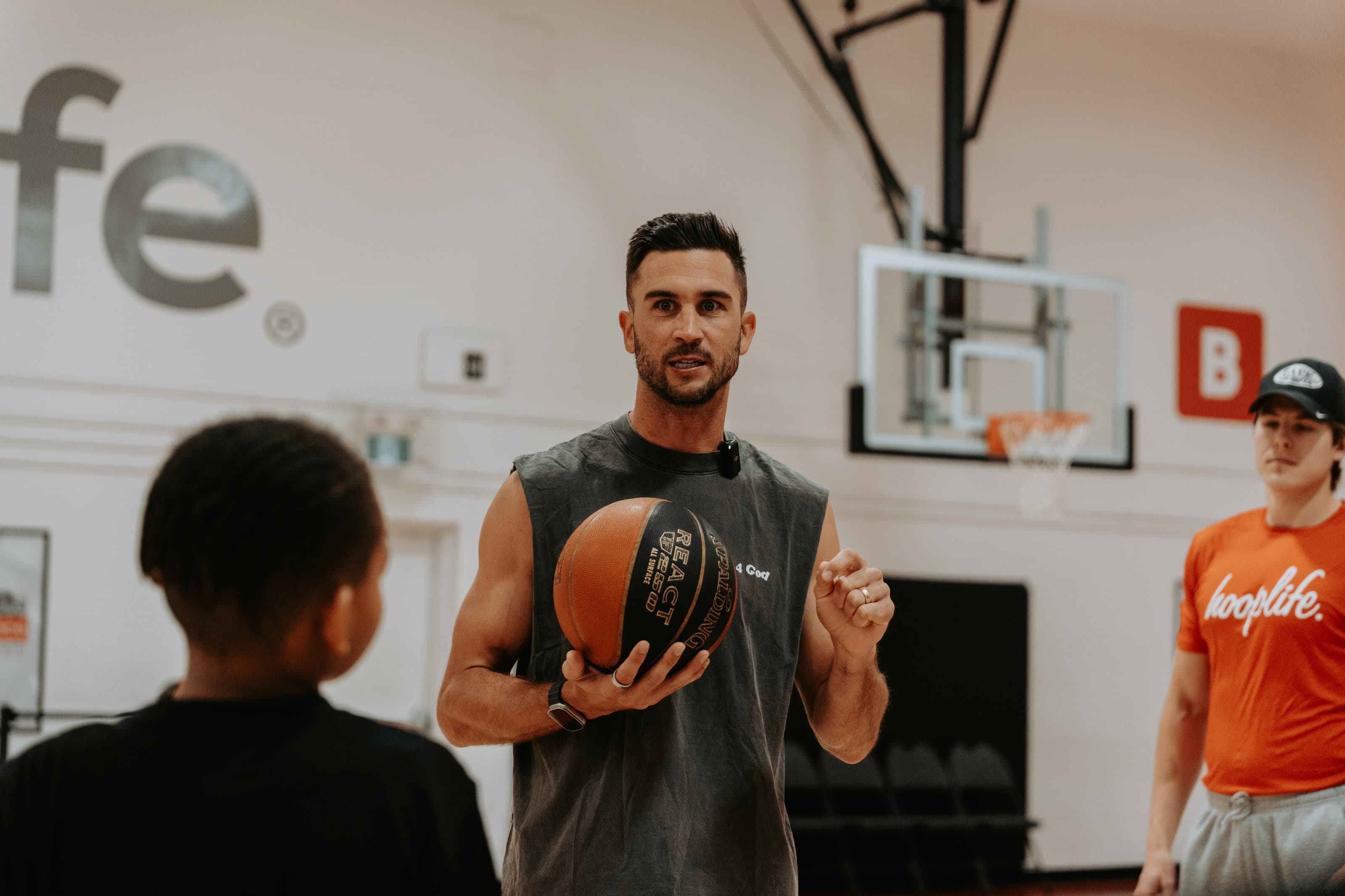 A HoopLife coach teaching during a weekly session
