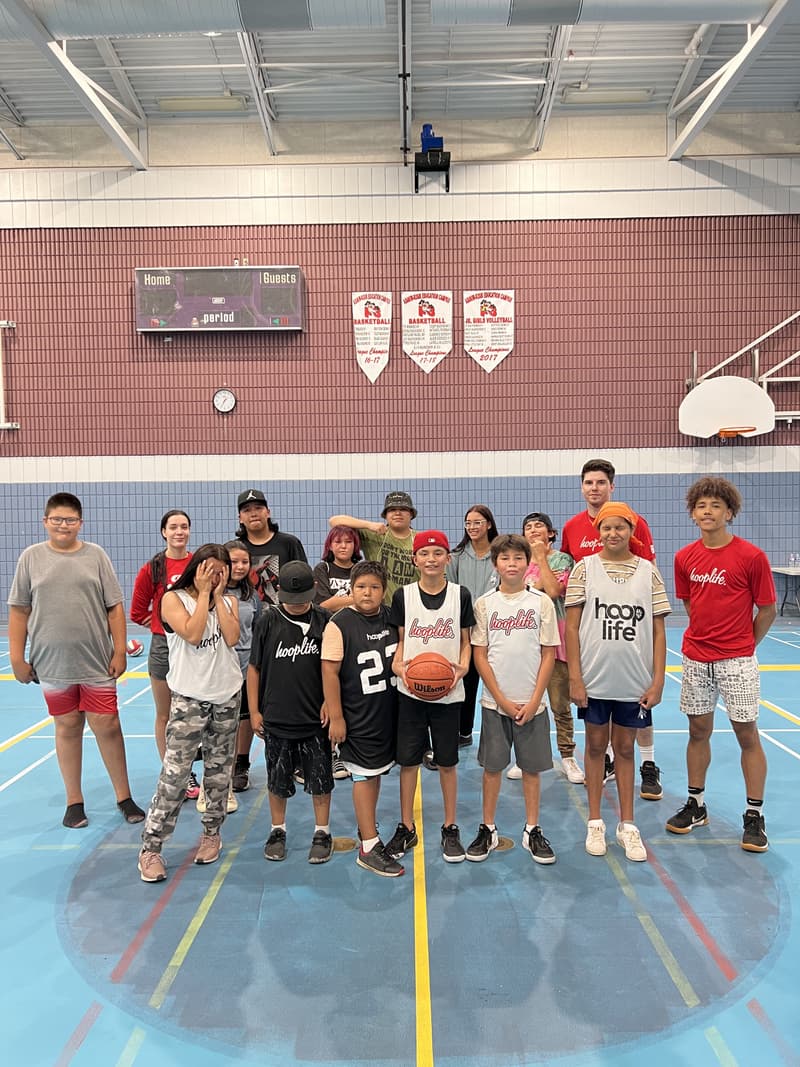 The whole Kawacatoose clinic group in hooplife pinnies with their coaches