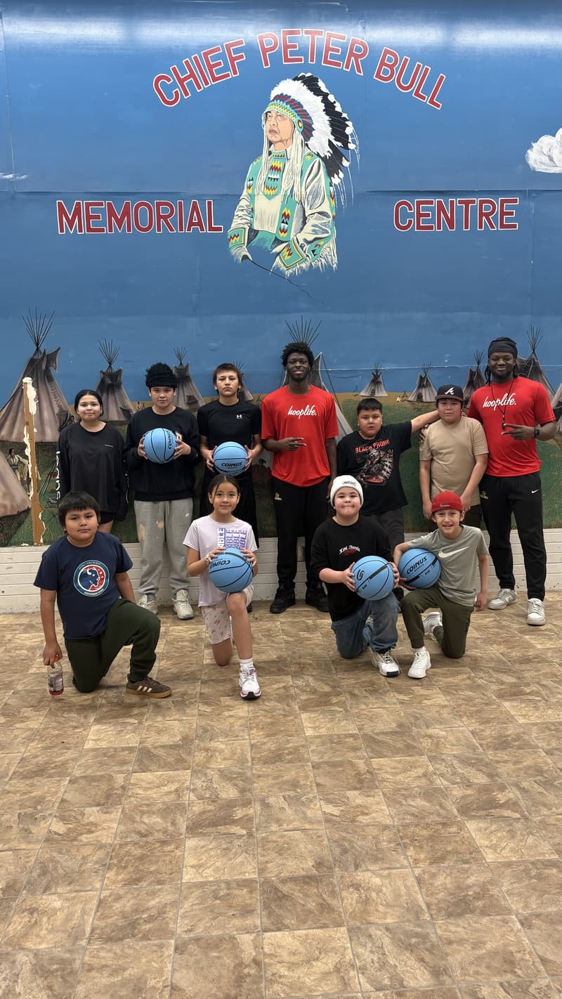 The Louis Bull clinic group under the Chief Peter Bull Memorial Centre mural