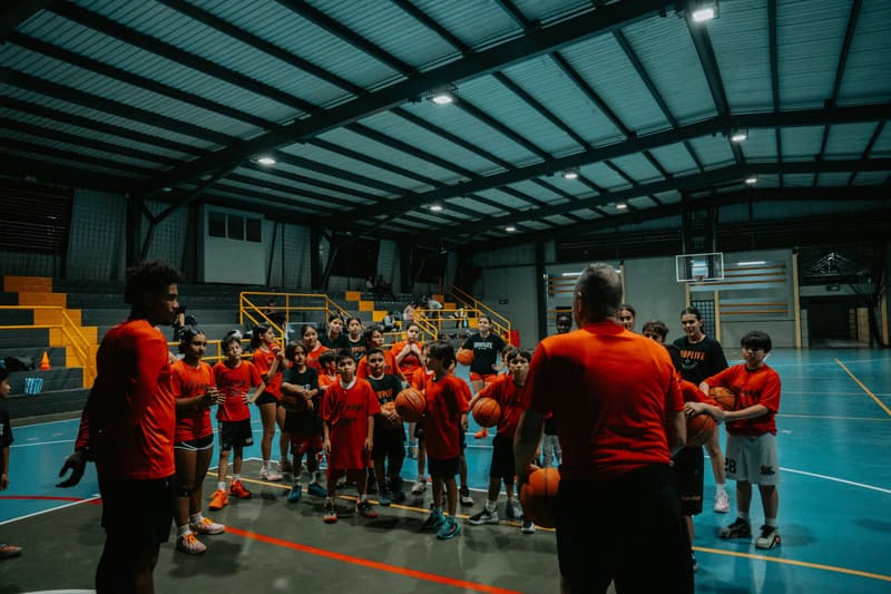 A coach addressing the whole clinic group in a Costa Rica gym