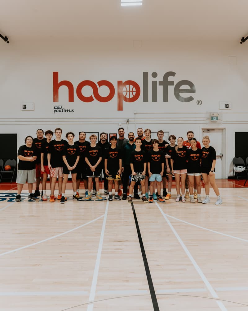 The teen session group under the hooplife sign