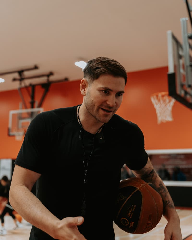 Marek Klassen coaching courtside at a HoopLife clinic