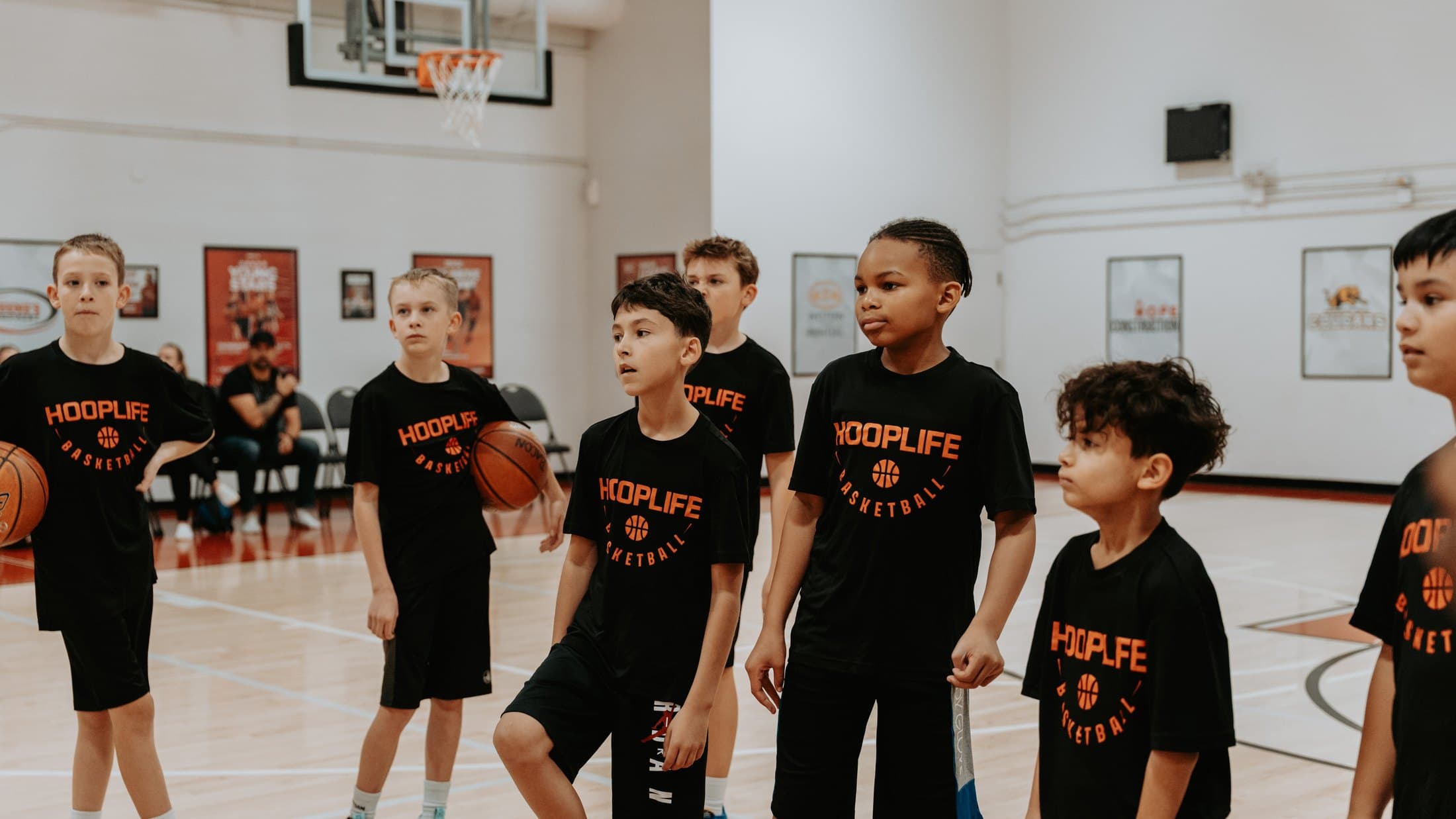 HoopLife summer campers with their coach at the HoopLife Centre