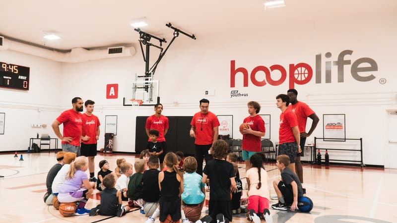 Young Stars players spread across the HoopLife court with their coaches
