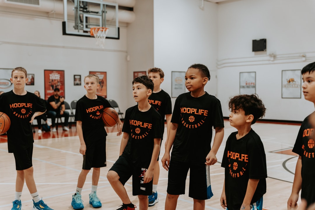 A group of HoopLife campers with basketballs waiting for the next drill in Regina