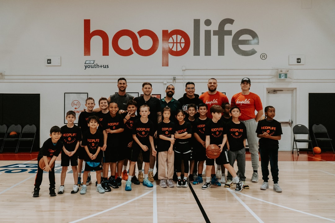 The full clinic group with the pros under the hooplife wordmark