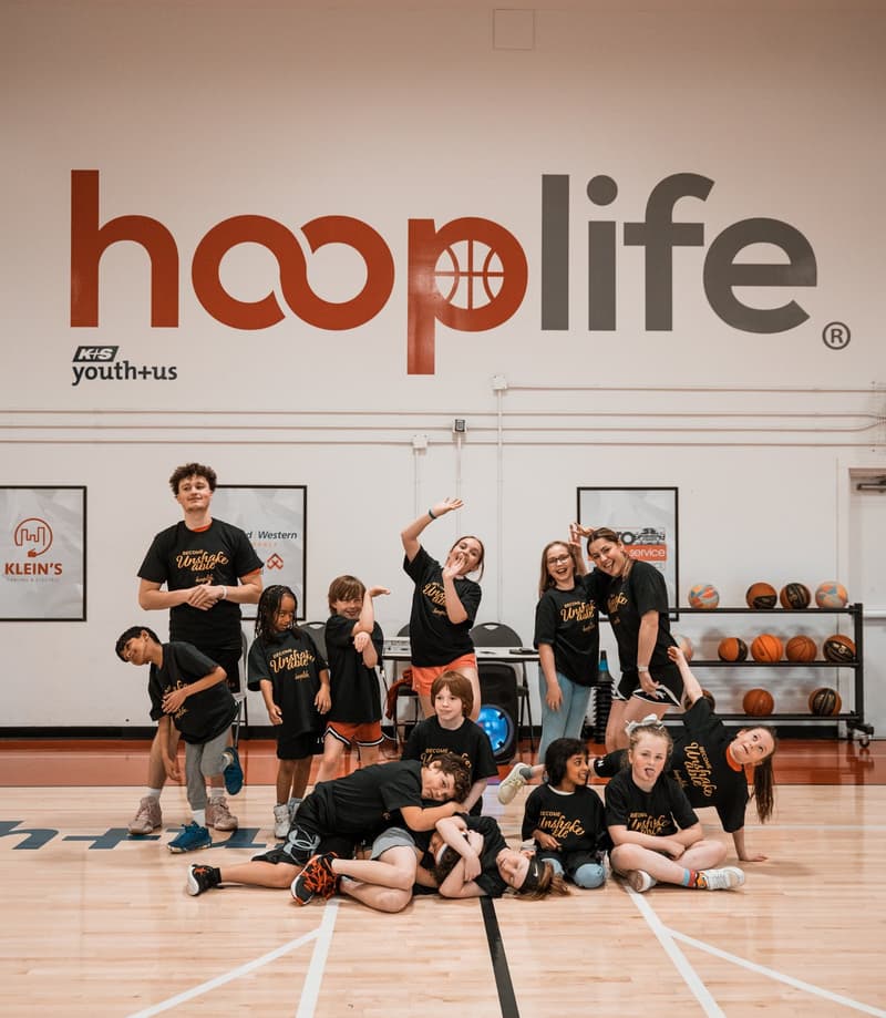 A full group of HoopLife players under the HoopLife wordmark