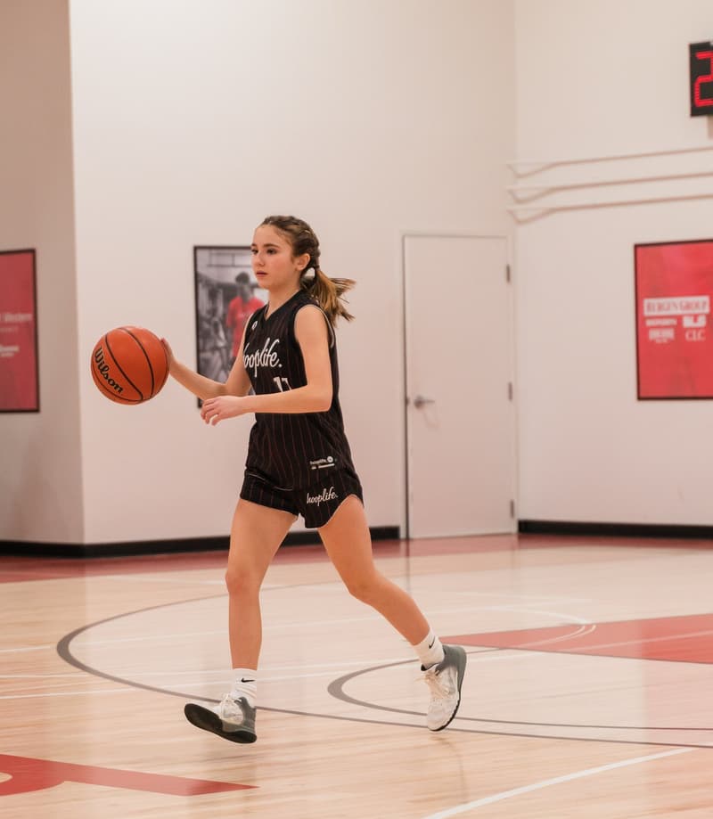 A HoopLife player pushing the ball up the floor
