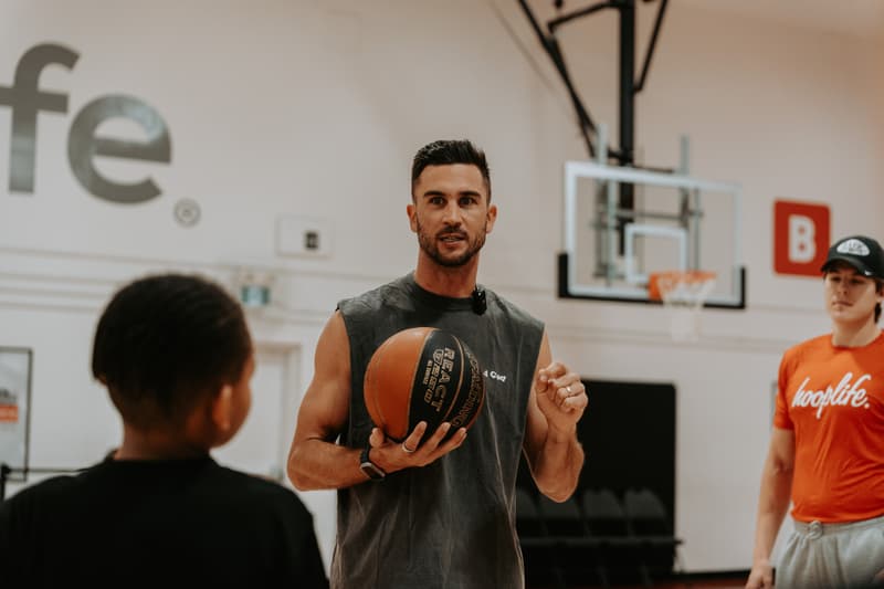 A HoopLife coach teaching during a weekly session