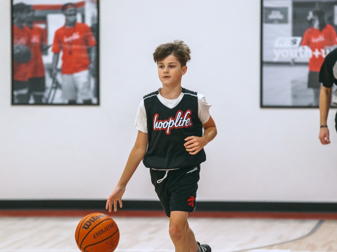 A camper bringing the ball up the floor in Regina