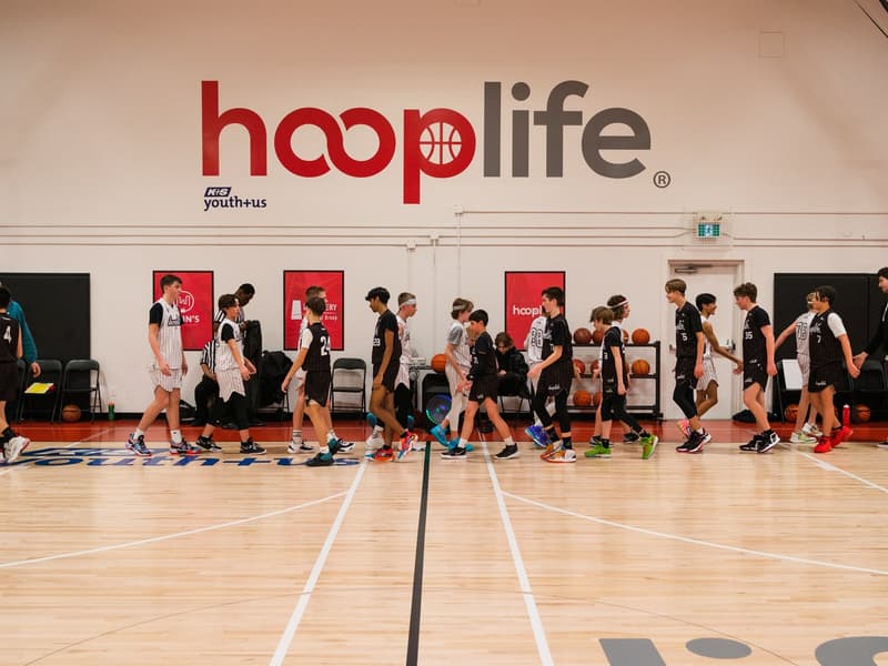 A full camp filling the court under the hooplife wall in Regina