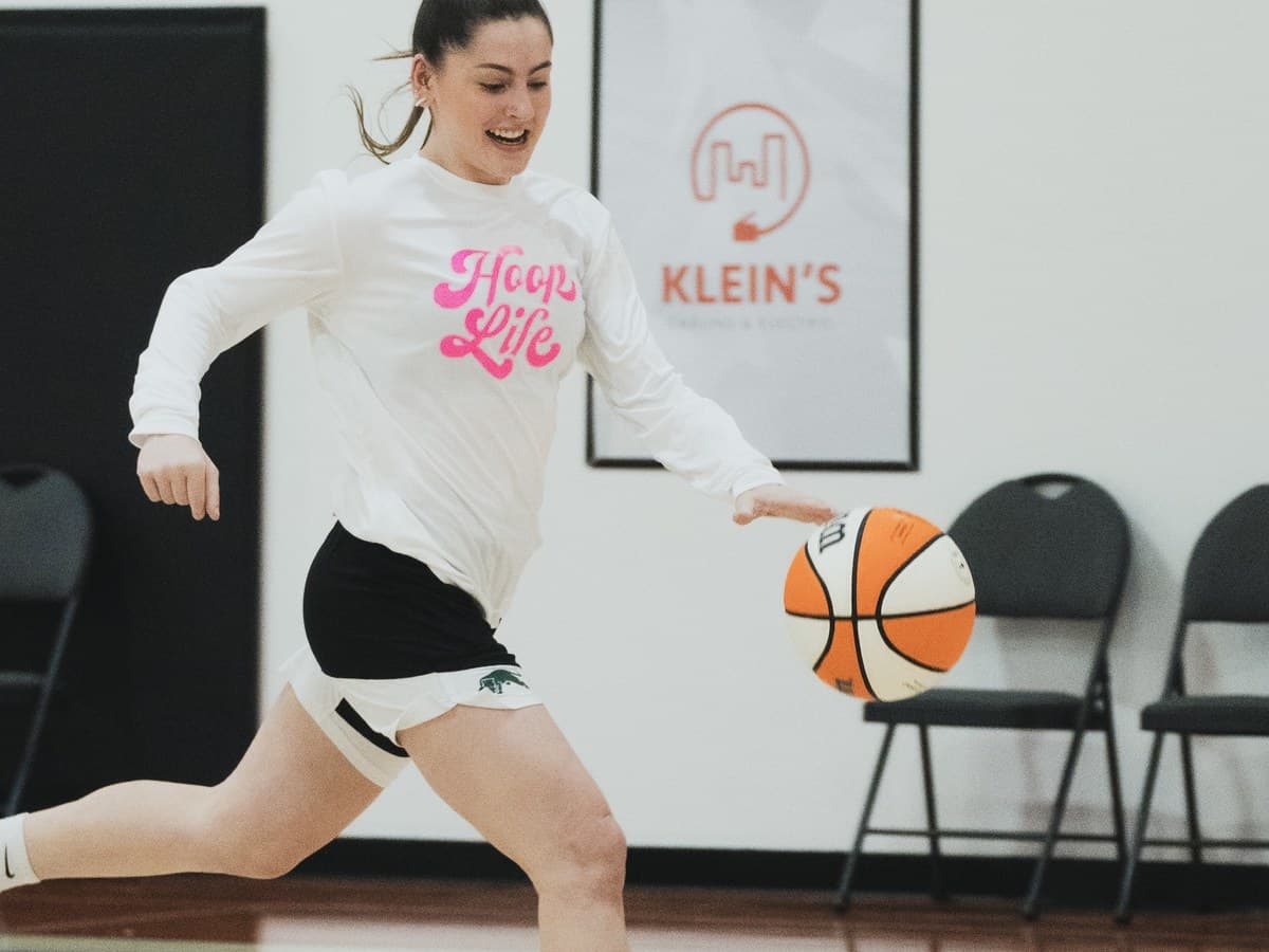 A young HoopLife player pushing the ball up the floor with confidence