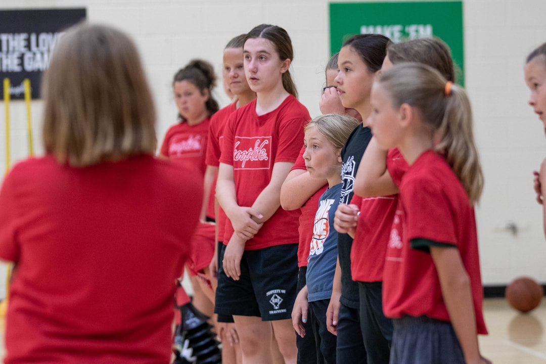 A HoopLife coach running a girls only session with a group of players in Regina