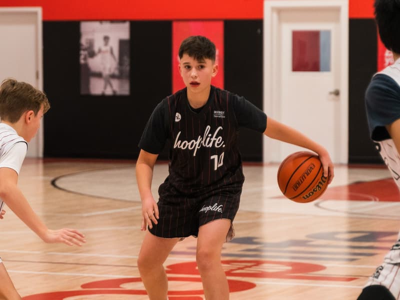 A HoopLife League player pushing the ball on the move