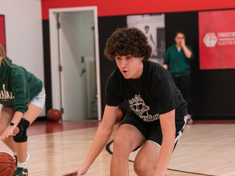 A HoopLife League player protecting his dribble