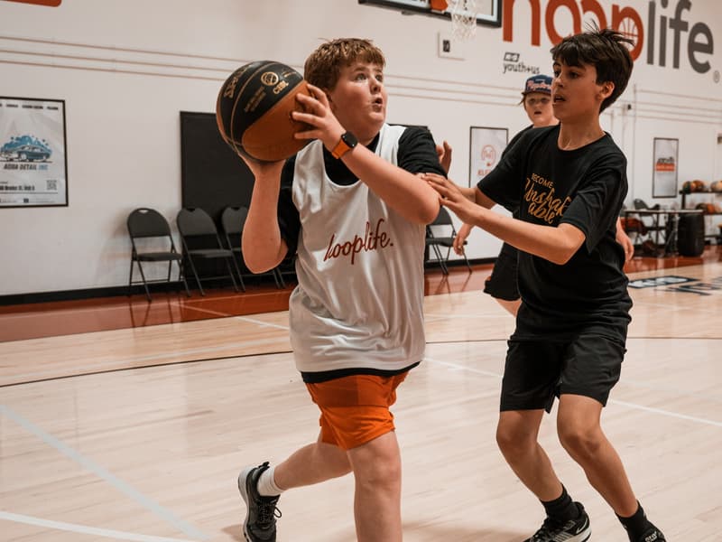 A HoopLife League player attacking the rim in Regina