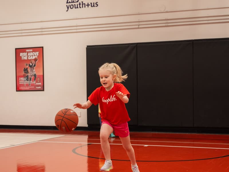 A Young Stars player shooting at the lowered hoop