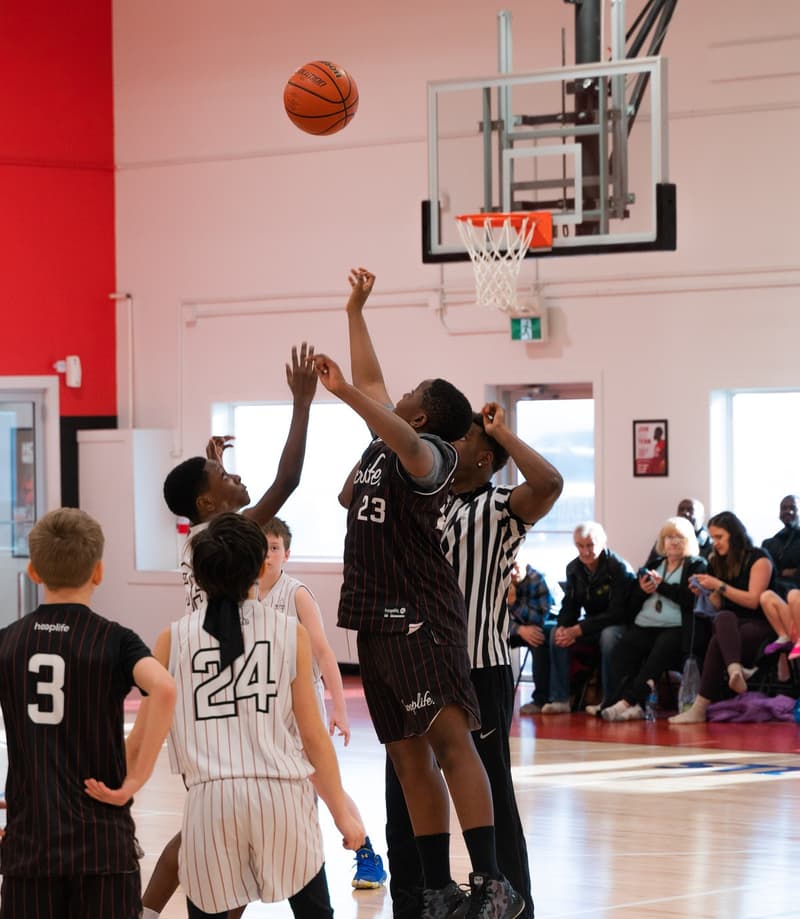 A contested shot in a HoopLife League game in Regina