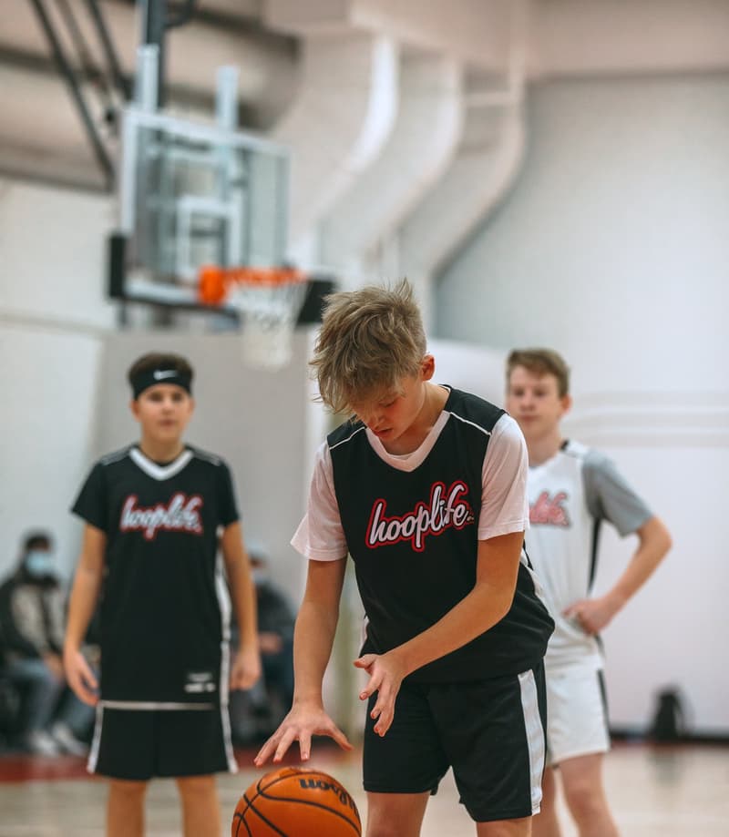 HoopLife League teammates running a handoff