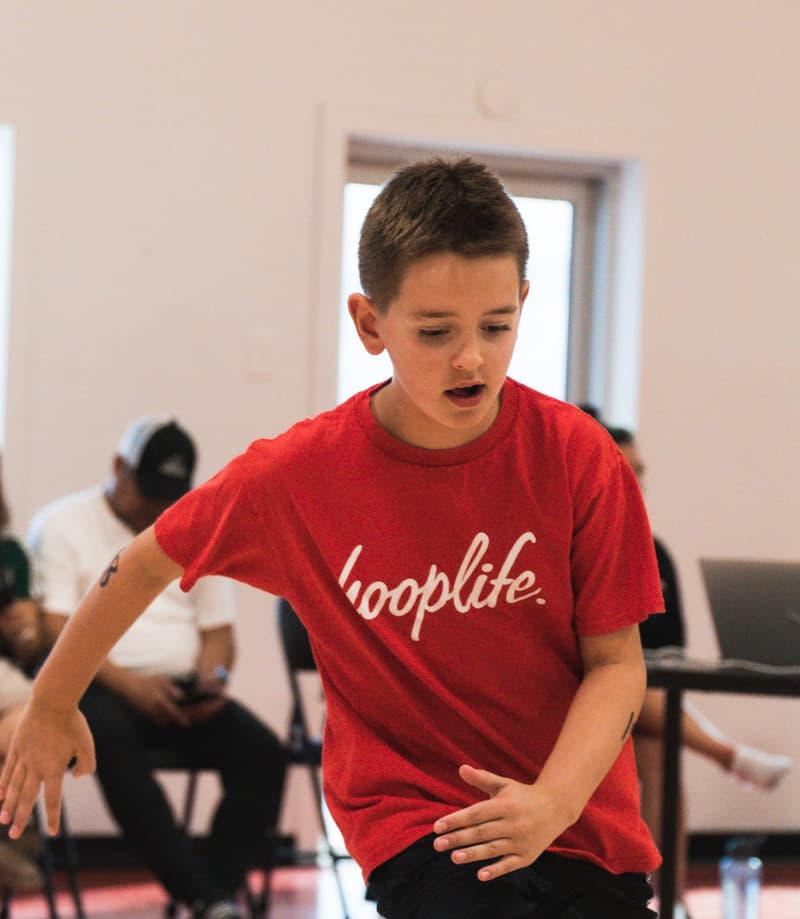 A young member sliding his feet on defence