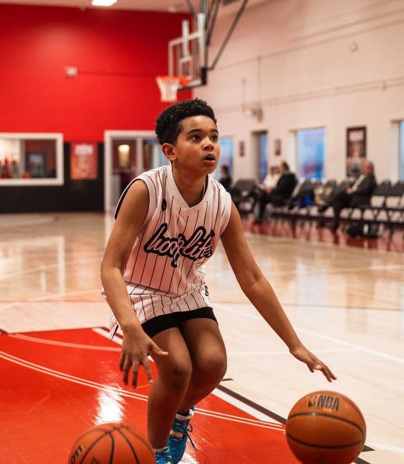 A young player working on his handle during open gym