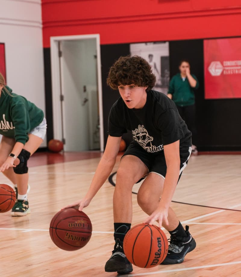 A player working two balls at once during a solo skills block