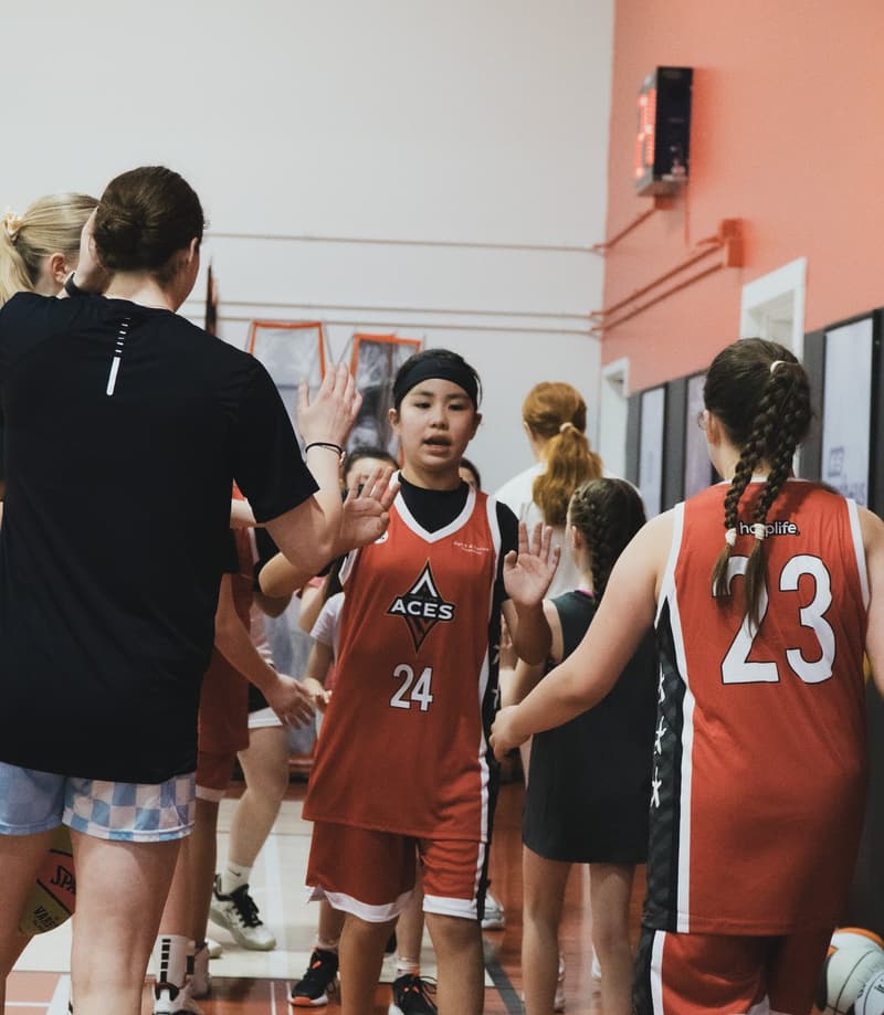 HoopLife players celebrating together after a game